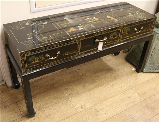 A Chinoiserie style black lacquered side table, W.140cm